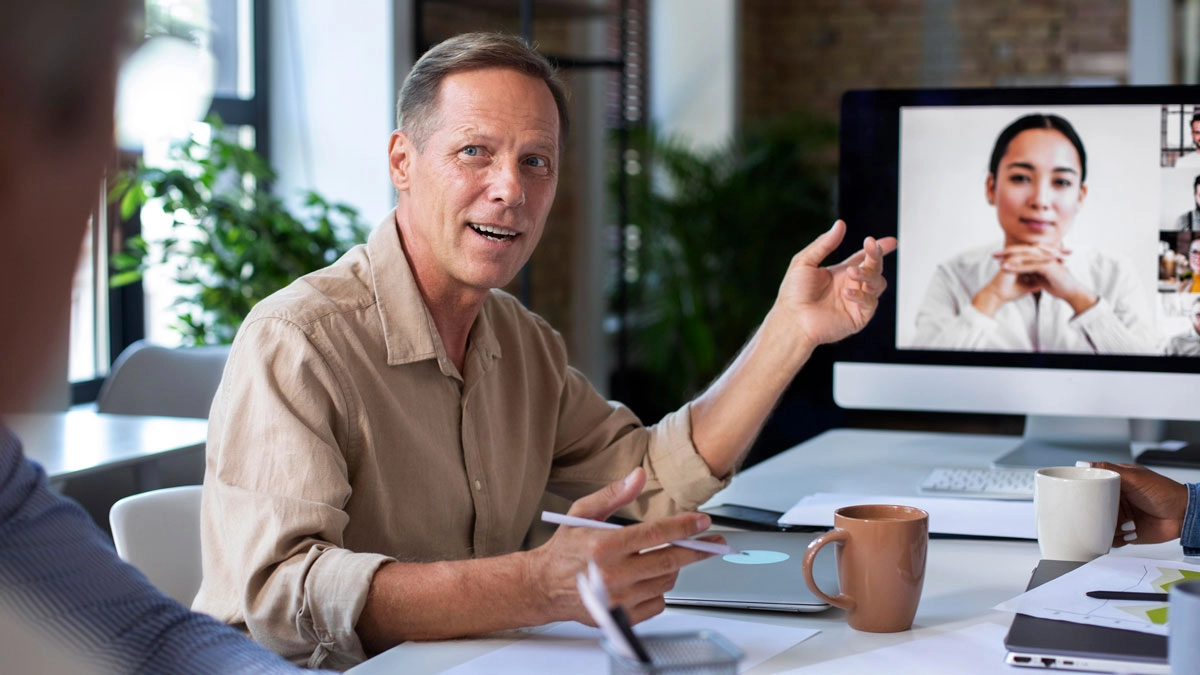 A man engages in a video call with a woman, both appearing focused and attentive during their conversation.